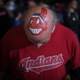 Jim Schulz of Elyria shows off his Cleveland Indians-mascot-painted head outside Progressive Field in Cleveland on Nov. 1, 2016. (Justin Merriman/Getty Images)